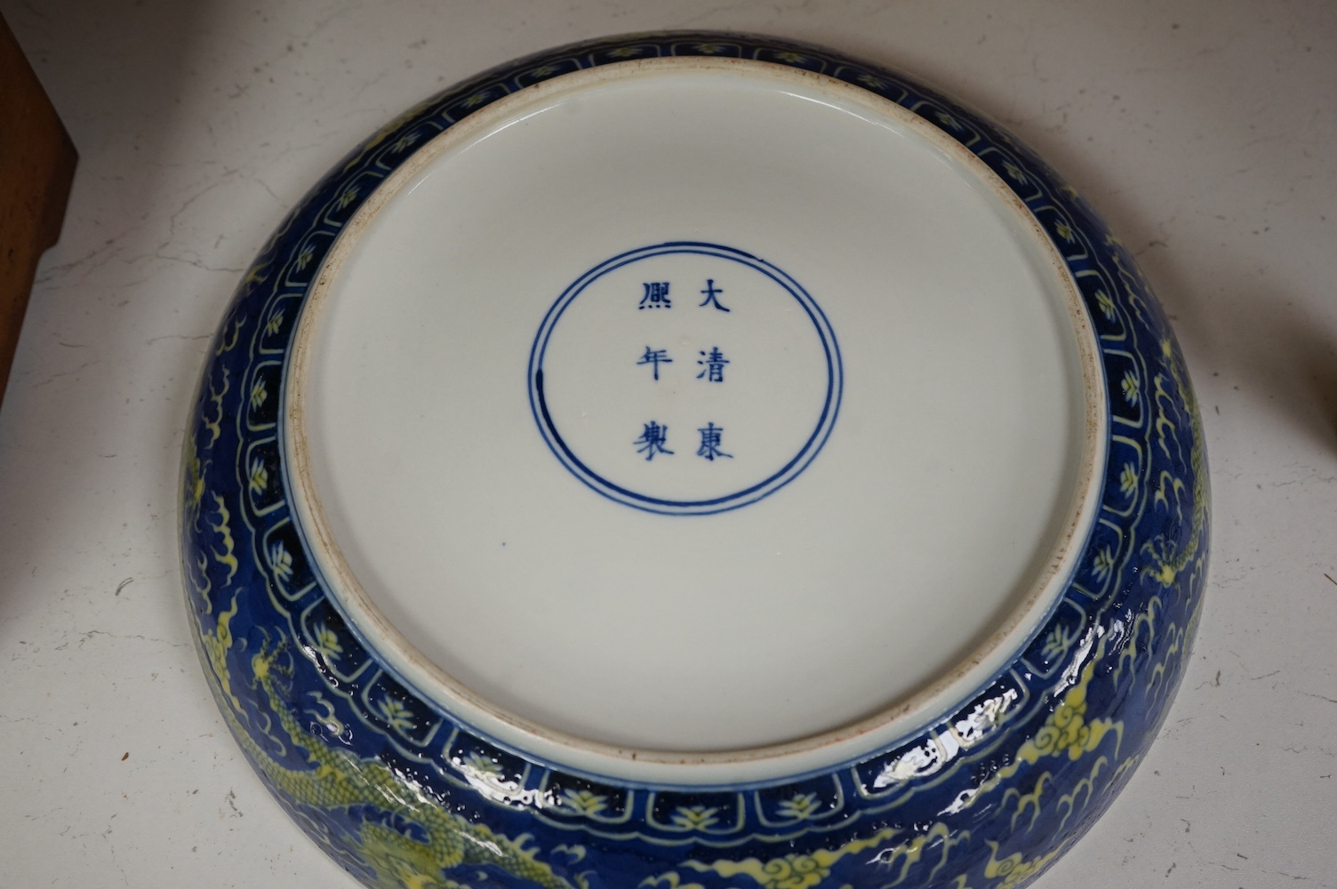 A Chinese blue and yellow glazed dragon dish, 33cm diameter., Condition - good